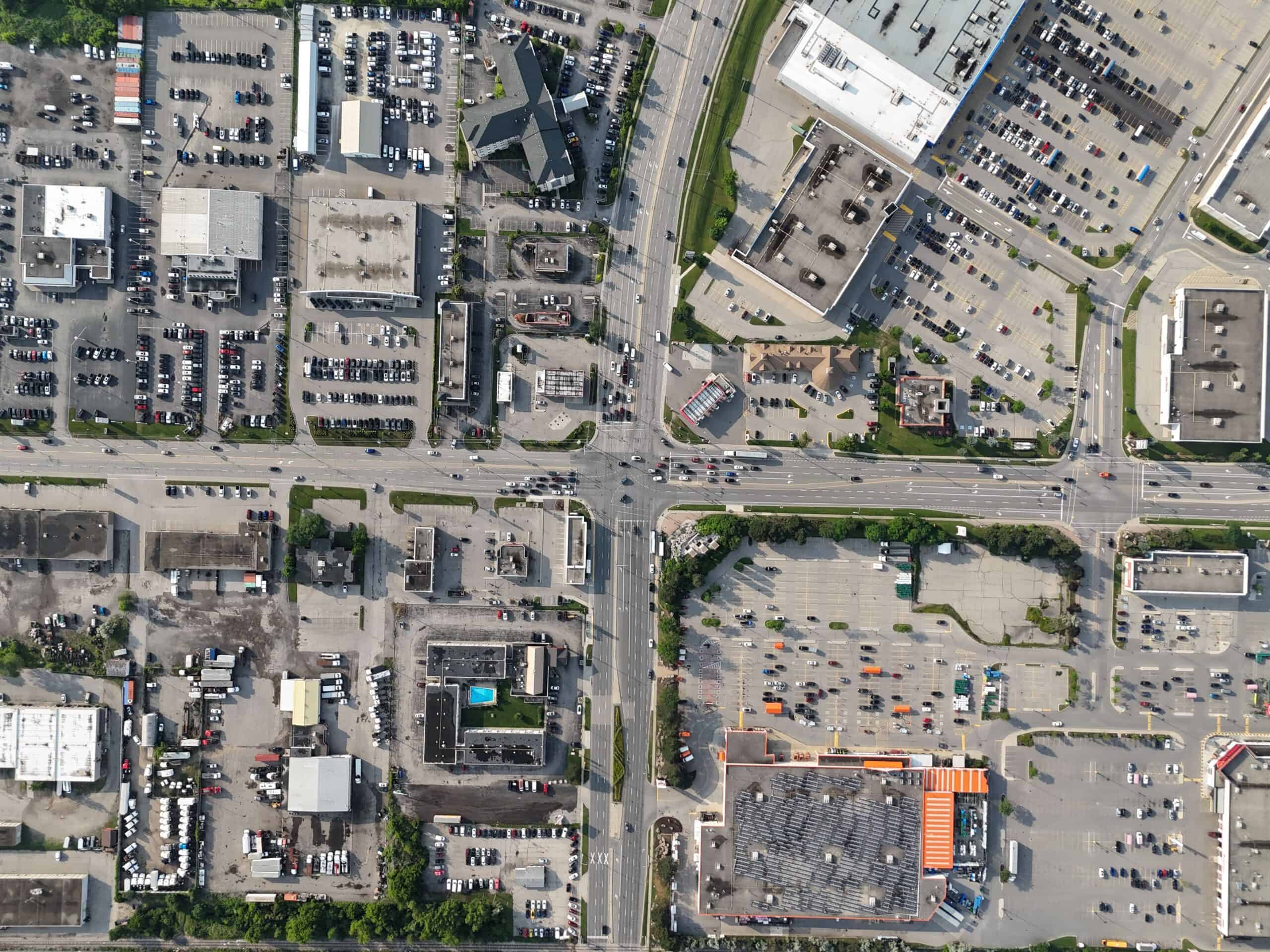 Aerial view of a commercial and industrial area with various buildings, parking lots, and roads An aerial view of a commercial and industrial area with various buildings, parking lots, and roads in Waterloo, Ontario, Canada